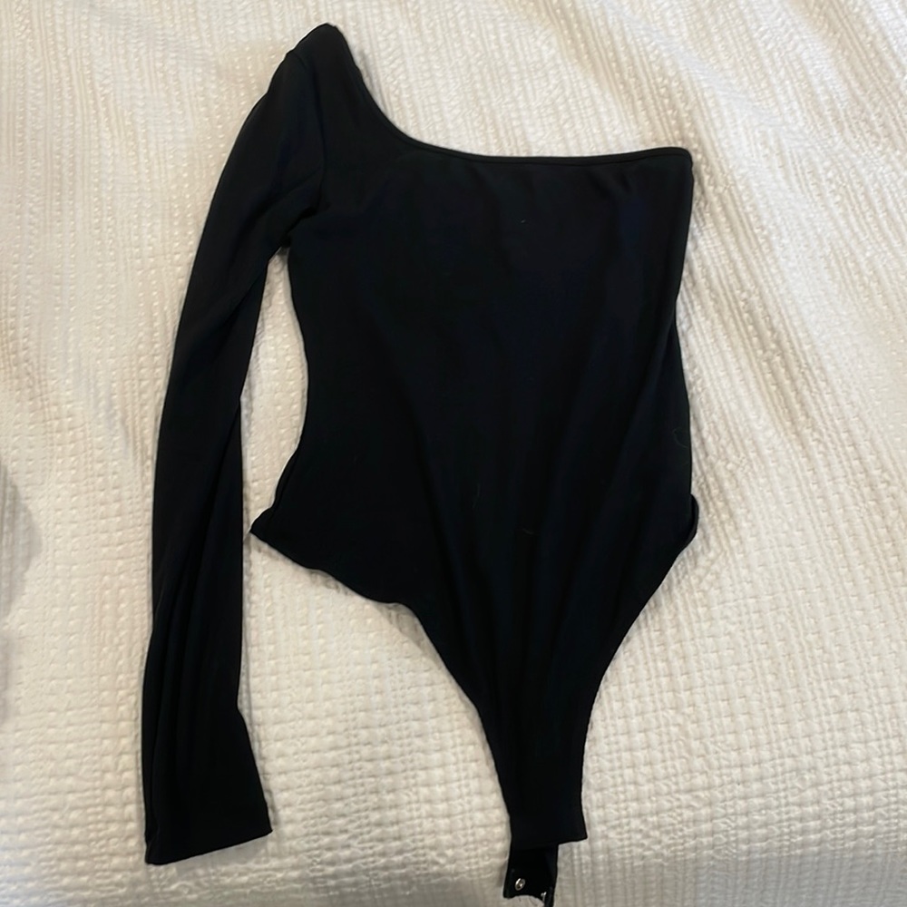 Black one shoulder body suit from Revolve.